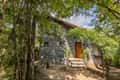 A stone cottage at Pench Tree Lodge