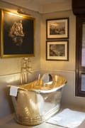 The brass bath in a Tented Jungle Suite