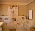 The stone shower in the Family Suite (Machhli)