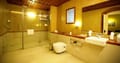 Tea Bungalow, Fort Kochi: Heritage Premium Room bathroom with glass shower cubicle, basin and pebble-paved floor
