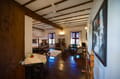 The Suite Room at The Old Courtyard Hotel: beamed ceiling, sitting area and dining table on the first floor