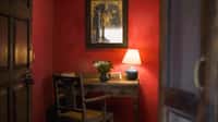 Writing desk against a deep red wall