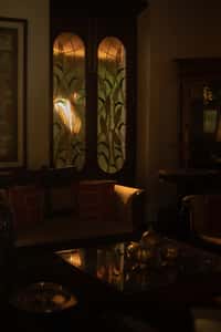 Backlit stained glass doors in a sitting room