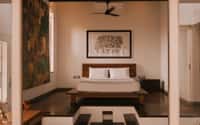 Heritage room with low bed and framed artwork