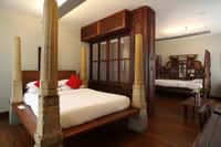 Karaikudi Suite with carved timber and stone columns