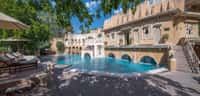 Swimming pool below the arcaded palace