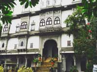 Carved white facade above the entrance steps