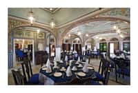 Frescoed dining hall laid for dinner