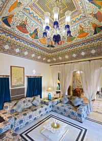 Suite under a painted and gilded ceiling