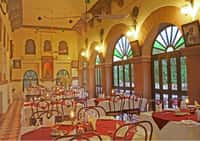 Dining hall with arched stained-glass windows