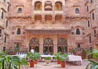 Sandstone facade with carved jharoka balconies