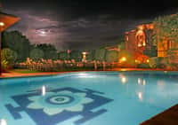 Pool at night with lotus floor motif