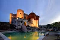 Swimming pool below the lit fort walls