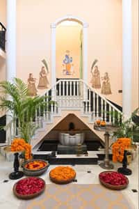 Painted entrance hall with marigolds and staircase