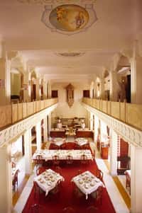 Restaurant interior with painted ceiling medallion