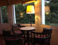 Lounge with standing lamp and bay window