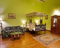 Royal Room with four-poster bed and sofa