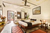 Poolside deluxe room with door open to a terrace