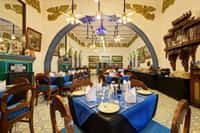 The Turquoise Diner, blue tiled arch and laid tables