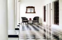 Arched corridor with chequered stone floor