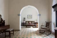 Arched room with patterned tile floor