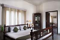 Bedroom with carved wooden bed