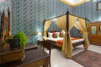 Four-poster bed in a Chamber of Princes suite