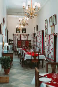 Dining room with chandelier and drapes