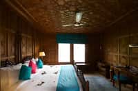 Suite bedroom with khatamband ceiling and writing desk