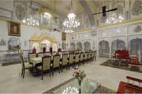 Mirror-work hall with a long dining table