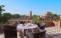 Rooftop terrace table with clock tower view