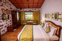 Room with stone wall and framed prints