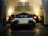 Bedroom with botanical prints above the bed