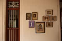 Wall of framed family portraits