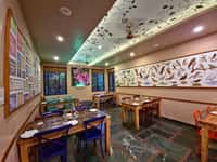 The restaurant at Tathastu Pench, bird prints along the wall
