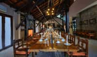 The dining hall at Kanha Earth Lodge