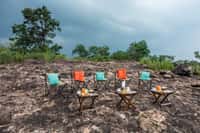 Chairs set out on the hilltop at the end of the sunset walk from Kanha Earth Lodge