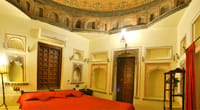 Deluxe Room beneath a painted dome ceiling, Castle Bijaipur, Bijaipur
