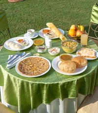 Indian breakfast spread on a garden table, Fort Dhariyawad, Dhariyawad