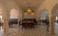 Indoor restaurant with carved marble pillars and scalloped arches, Fort Dhariyawad, Dhariyawad
