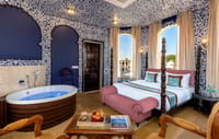 Chetak Suite bedroom with heritage styling, Kesar Bagh Palace, Chittorgarh