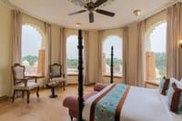 Padmini Suite bedroom with arched windows, Kesar Bagh Palace, Chittorgarh
