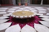 Marble lotus fountain ringed with rose petals in the courtyard, Padmaa, Jaipur