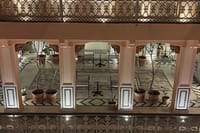 View across the pink-columned courtyard restaurant from an upper gallery, Padmaa, Jaipur