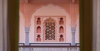 Rose-pink arches, niches and jaali screen of the haveli's courtyard facade, Padmaa, Jaipur