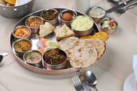 Traditional Marwari thali served in copper bowls, Ranbanka Palace, Jodhpur