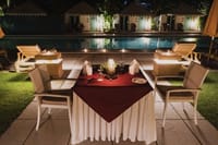 Private candlelit dinner beside the pool at night, Rawla Narlai, Narlai