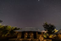 Luxury tent beneath a star-filled night sky, Soulacia Hotel & Resort, Kanha