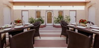 Al fresco dining tables in the Surya Chowk courtyard, Surya Haveli, Jaipur