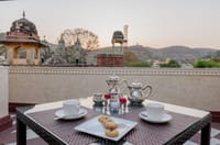 Tea served on the rooftop terrace overlooking Amer's temples, Surya Haveli, Jaipur